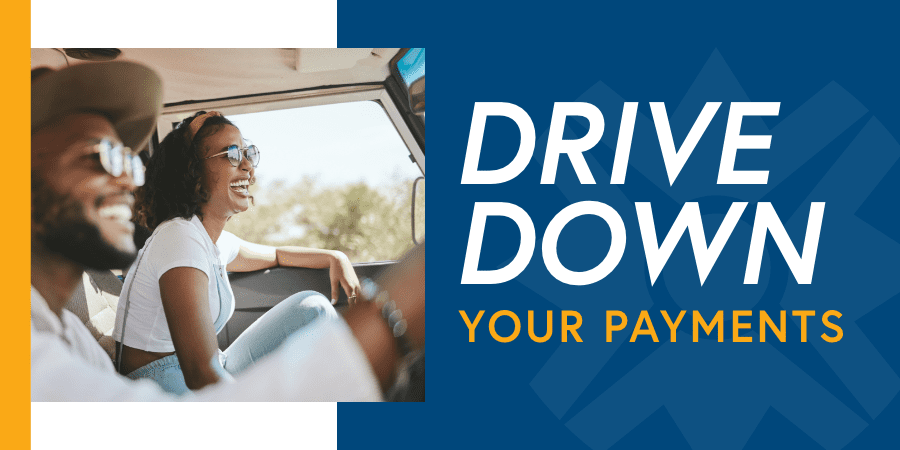 A man and woman happily driving in a jeep. The words at the right: drive down payments.