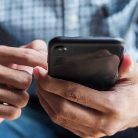 A man holding a smart phone.